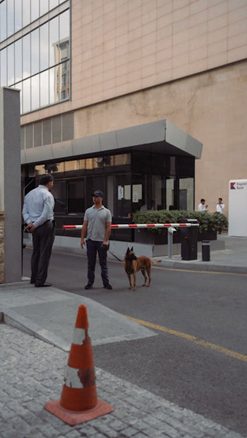 A person talking to a security guard 