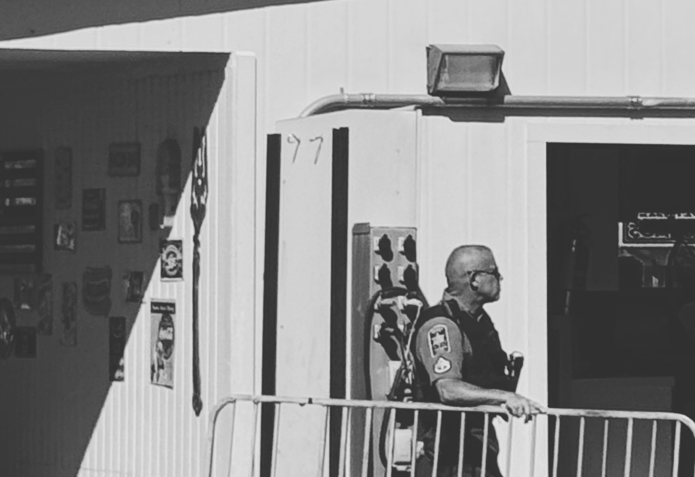 Security guard standing outside an empty building