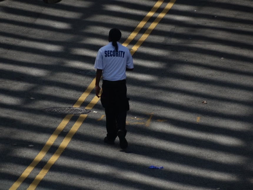 Security guard patrolling an apartment complex walkway