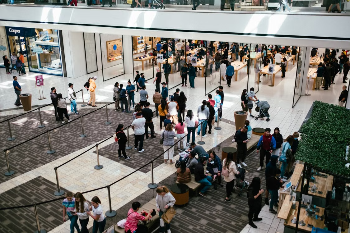 Shoppers walking through a crowded mall