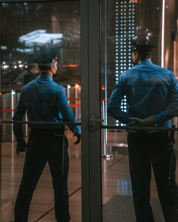 Security guard checking access points at an apartment complex entrance