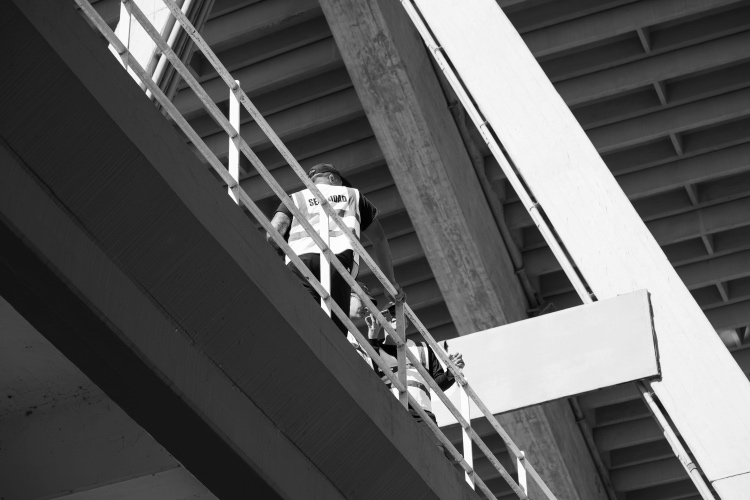 Security guard performing an after-hours patrol at a construction site