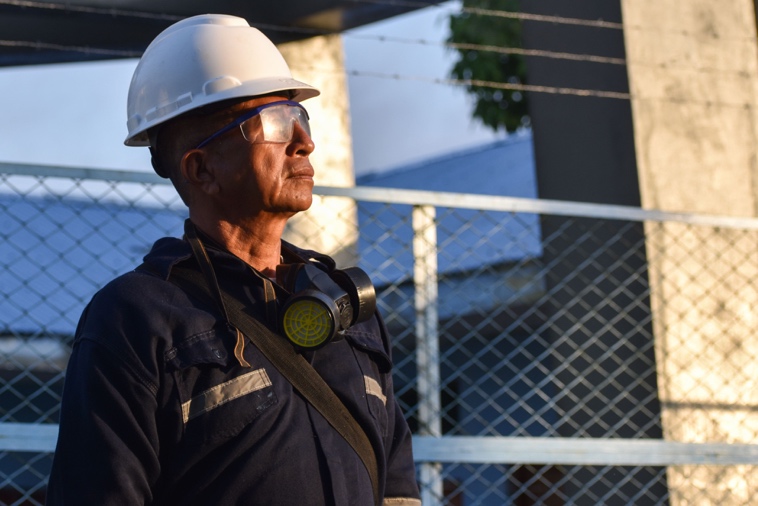 Security professional managing access control at a busy construction site
