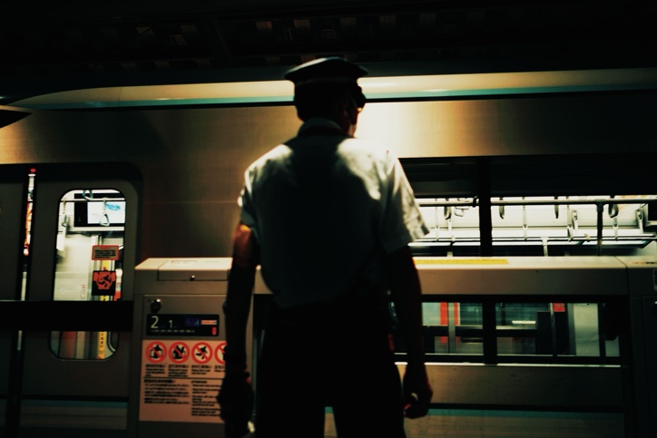  Security professional checking property lighting and access points during a routine patrol