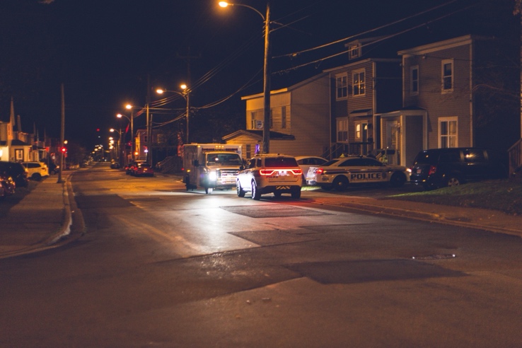 Security vehicle monitoring a property during an evening patrol