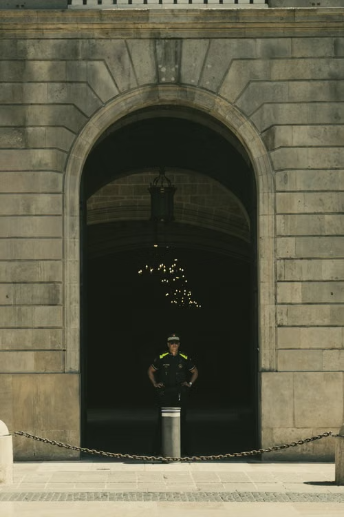 a security guard standing outside a building