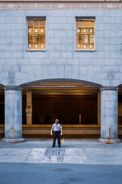 a security guard standing outside a building